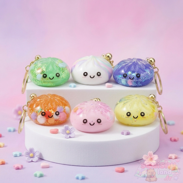 Six porte-clés squishy dumpling kawaii pastel sur un présentoir blanc